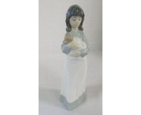 Nao figure of a girl holding a dog