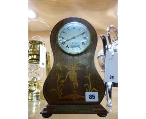 An Edwardian balloon shaped mahogany and marquetry mantel clock.