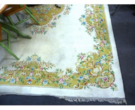 A large Chinese Ivory ground carpet