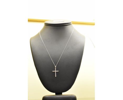 A platinum and diamond cross pendant on 18ct white gold chain