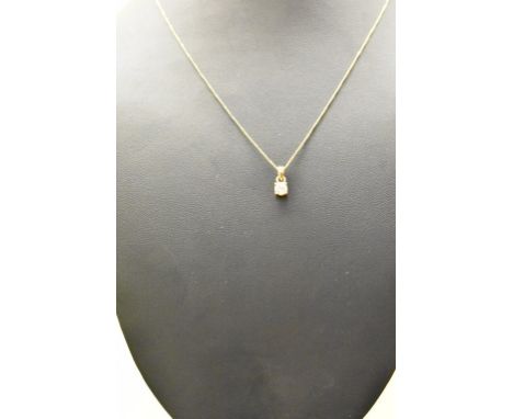 An 18ct yellow gold and diamond solitaire pendant on chain, 0.25ct
