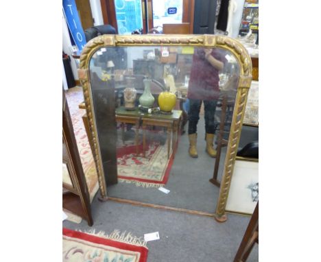 A giltwood over mantel mirror.