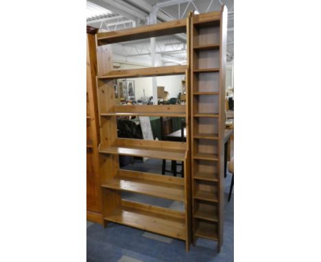 A Stained Pine Six Shelf Waterfall Bookcase. 93cm Wide Together with a Narrow Storage Rack to Match 