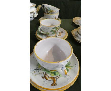 A Collection of Spanish Faience Breakfast Teacups and Saucers Comprising Three Trios and a Cup