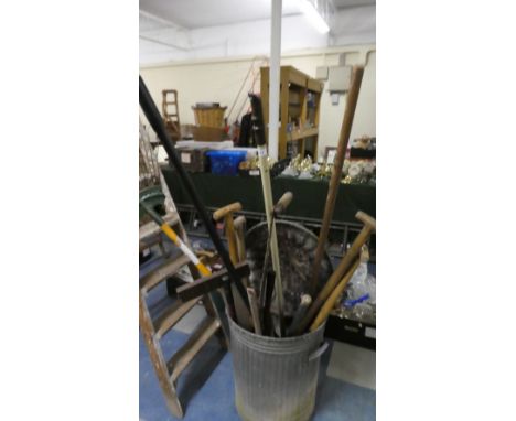 A Galvanized Bin Containing Garden Tools
