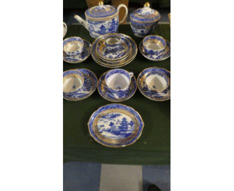 A Staffordshire Blue, Gilt and White Collection of Various Teawares to Include Teapot, Lidded Sugar Bowl, Four Tea Bowls, Cof