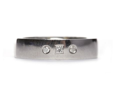 GENTLEMAN'S PLATINUM DIAMOND SET BAND
with three countersunk diamonds, 5.4mm wide, size R, 13.2g