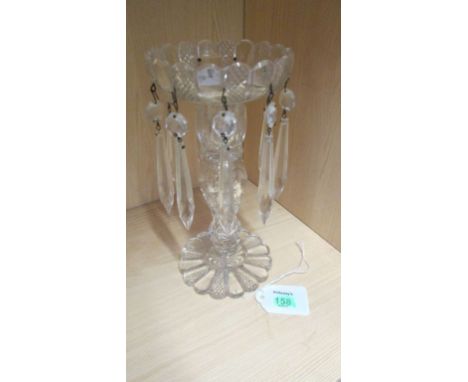 A single Edwardian clear glass table candlestick, having a faceted column and icicle lustre drops 