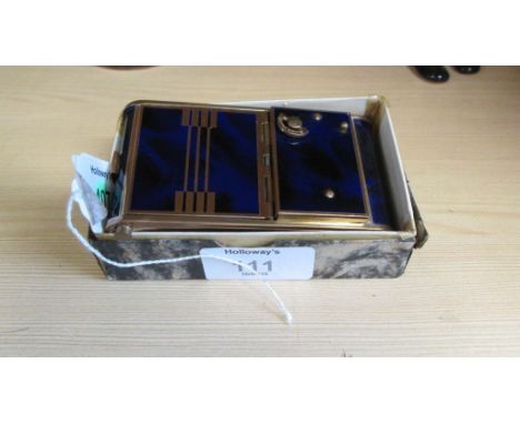 A vintage musical compact/lipstick cigarette case
