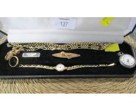 3 gold rings, an enamel and silver cased fob watch, two gold chains, a gold wristwatch and a bar brooch