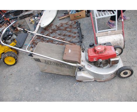 HR216 Honda Mower with roller, (needs attention).