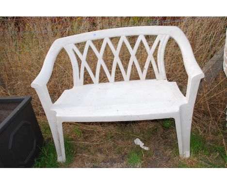 Two seater plastic garden bench.