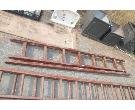 Double 8 rung extending wooden ladder.