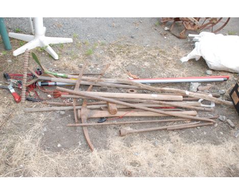 Large quantity of garden tools, pick axes, lopper, hose, steel bars, etc.,