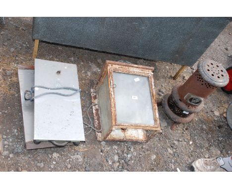 Vintage Valor paraffin stove, two hot plates and an old railway lantern type external wall-lamp.