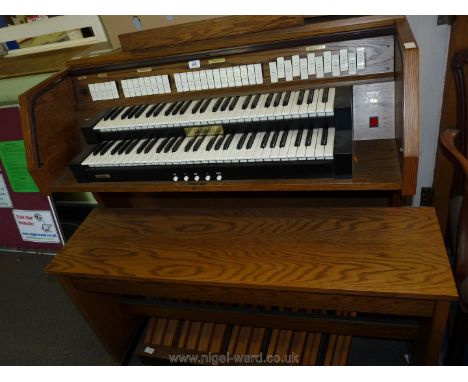 A Viscount Domus DK520 electric Organ having two 56 key manuals and 27 pedal keyboard, 38 stops, six position transposer, lou