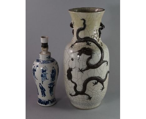 A Chinese baluster vase, 20th century, moulded and decorated with long dragons on white crackle glaze ground, 46cm high, toge