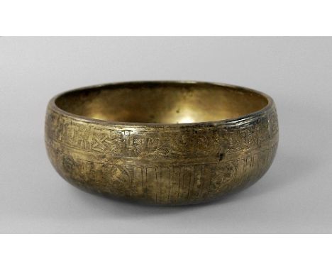 A Safavid high-tin bronze bowl, c.14th/15th Century, of shallow form, decorated externally with band of pseudo-script above f