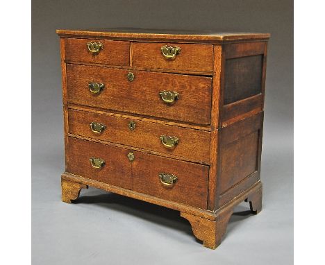 A George III oak chest of drawers, rectangular top over two short and three long drawers, raised on bracket feet, 103cm high 