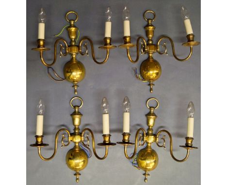 A pair of brass Dutch style six light chandeliers, with bulbous columns, emitting scolding arms, terminating in sconces and d