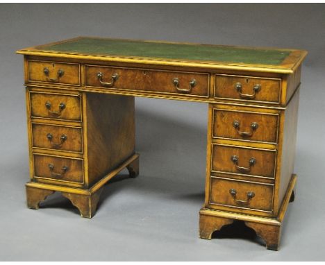 A Victorian mahogany leather top pedestal desk, 19th century, three short freeze drawers over three short drawers, raised on 