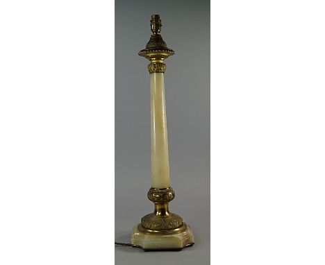 A Victorian gilt metal and onyx lamp base, with beaded and foliate top, on tapering cylindrical column, terminating in foliat