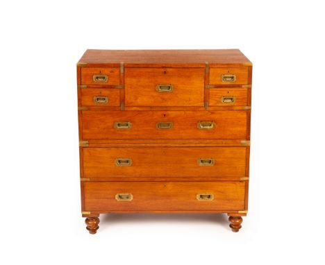 A 19th Century teak and brass campaign chest, with secretaire, John Pound & Co, London, four short over three long with the u