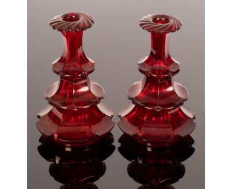 A pair of red Bohemian cut glass bottles, 19th Century, with three tiers of faceted lappets, 20cm high CONDITION REPORT: One 