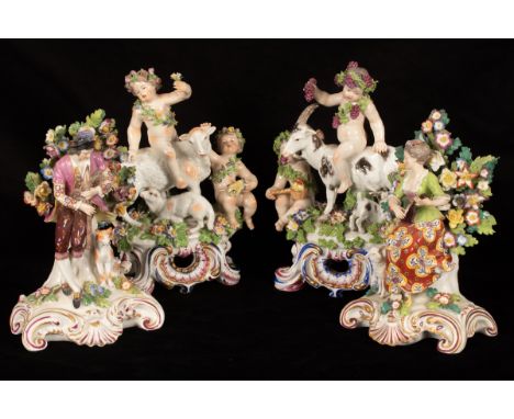 A pair of Bow style figure groups of Summer and Autumn on a sheep and goat, 24cm high and a pair of Chelsea style figures of 