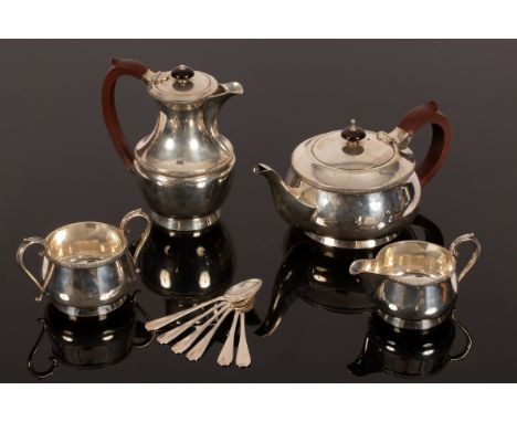 A silver tea service, J B Chatterley & Sons Ltd., Birmingham 1947, comprising a tea pot, 12cm high, a coffee pot, 17.5cm high