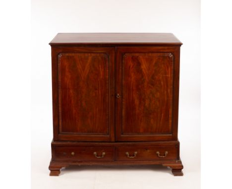 A George III mahogany press cupboard enclosed by panel doors over two short drawers, 126cm wide CONDITION REPORT: Condition i