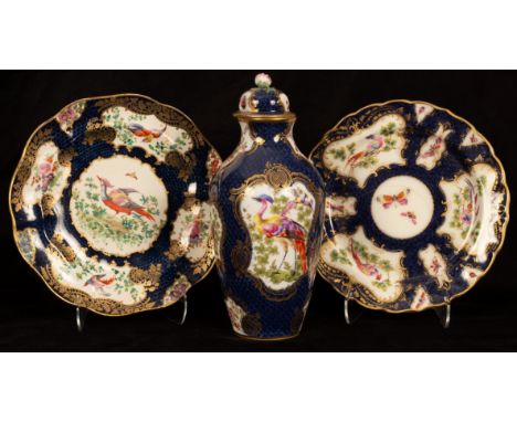 A Worcester style vase and cover, decorated fancy bird cartouches on blue scale ground, 26cm high, a Royal Worcester plate an