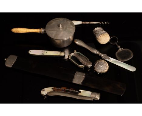 A Spanish tortoiseshell, mother of pearl and silver inlaid folding knife of curved form, 20cm long extended, a silver mounted