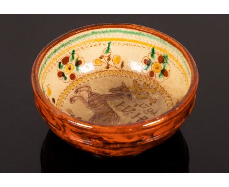 A small glazed bowl, the interior decorated a deer with the initials HV and HR and the date 1791, the base incised HV HR, 14c