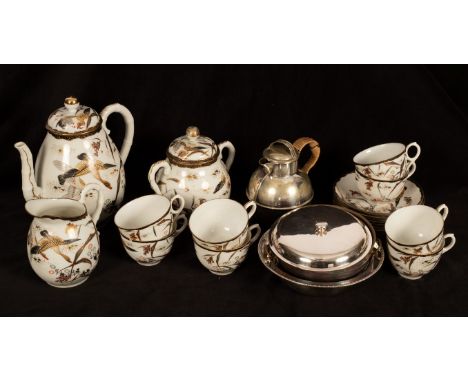 An Oriental style tea set comprising eight cups, seven saucers, a teapot, milk jug and sugar basin and lid, together with a p