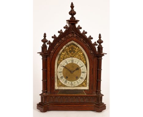 A Victorian oak cased mantel clock of Gothic Revival design, presentation plaque dated 1894, 57cm high/Provenance: The Estate