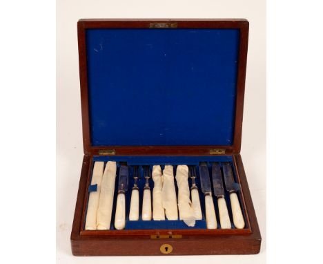 A set of twelve silver dessert knives and forks, Vander & Hedges, London 1915, with mother-of-pearl handles, cased within a f