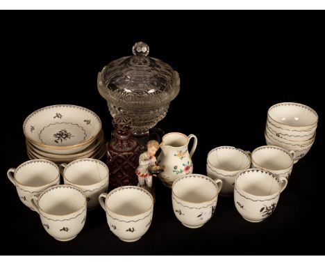 An English porcelain part service of five tea bowls, eight coffee cups and six saucers painted in black with flowers, a Worce