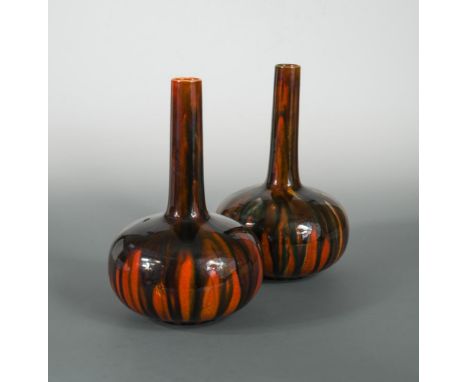 A pair of Burmantofts bottle vases, possibly designed by Dr Christopher Dresser, each with incised decoration and glazed in m