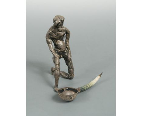 A late 20th century silver statue together with a mid 20th century spoon, the statue, double sponsor marked (skeleton mark 'O