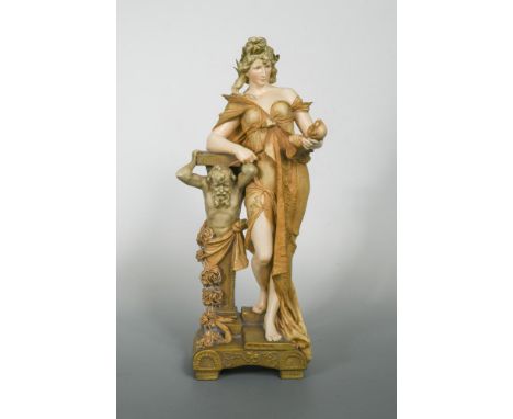 Ernst Wahliss (Austrian 1837-1900), an Art Nouveau pottery figure of a pretty young woman, modelled holding a male bust sculp