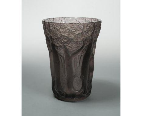 An early 20th century moulded amethyst glass vase, of flared cylindrical form moulded with a forest landscape, unsigned 26cm 