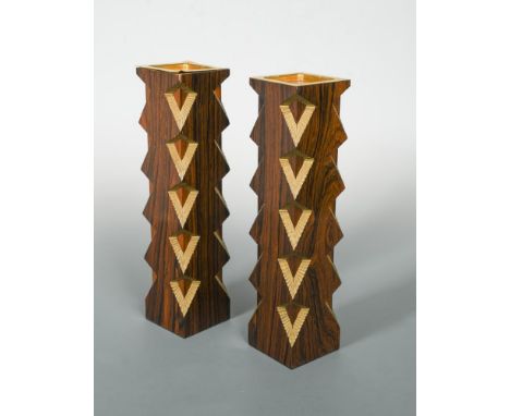 § Stuart Devlin, (Australian, born 1931), a pair of Indian rosewood and parcel gilt candlesticks, gilt name plaque to undersi