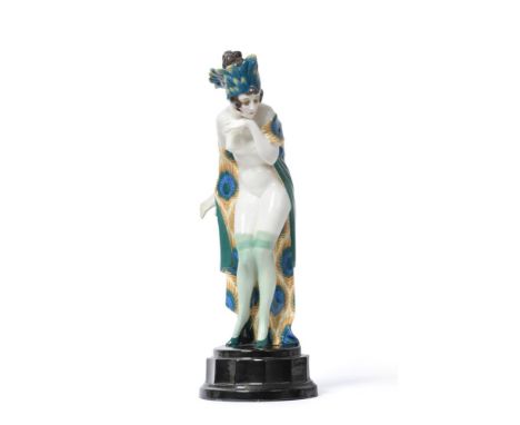 Wilhelm Thomasch for Goldscheider, 'Fascination', a pottery figure of a femal nude, the young woman wearing a feather headdre