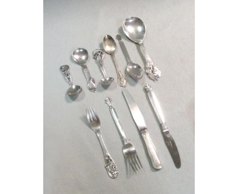 A harlequin collection of 8 Art Nouveau style Danish metalwares silver spoons, with silver plated additions, the five large s