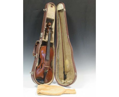 An early 20th century violin with one-piece back and red/brown varnish, old repairs, with bowThe length of the back of the vi