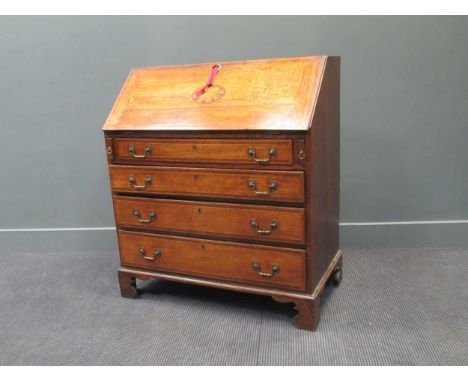A George III inlaid oak bureau, the fall front above four long drawers on bracket feet, 106 x 94 x 52cm