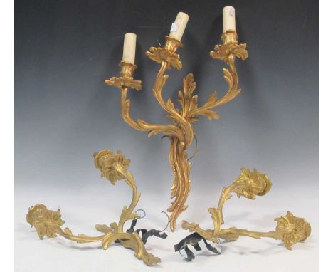 An ormolu three-light wall light in rococo style