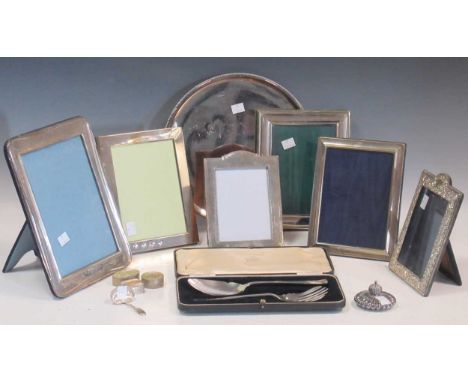 Six silver photograph frames, a caddy spoon, lobed paperweight and various plated items