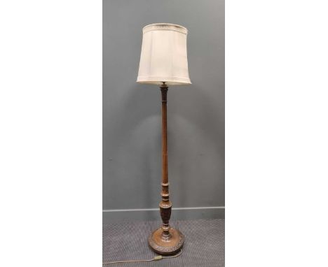 A carved reeded column standard lamp